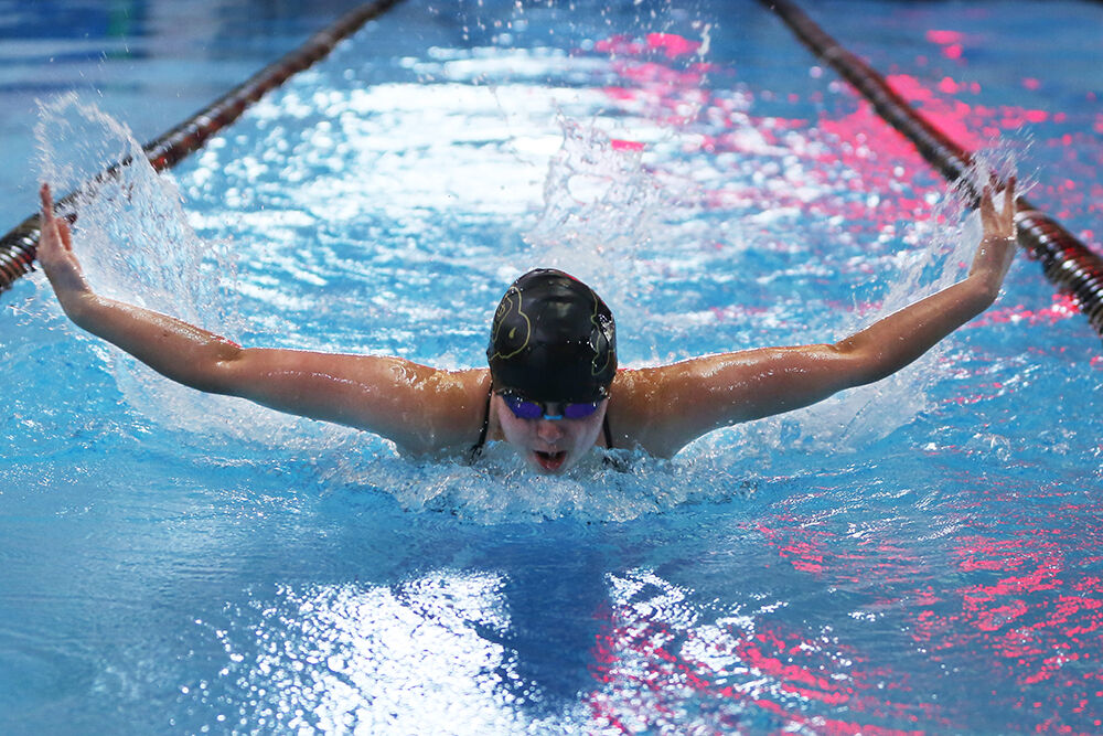Vivyan Gripp takes a breath during the 100-yard butterfly